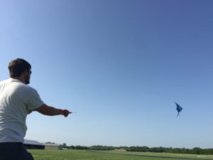Powell flying a stunt kite